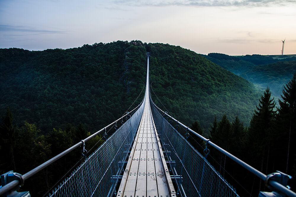 Suspended mountain bridge over valley