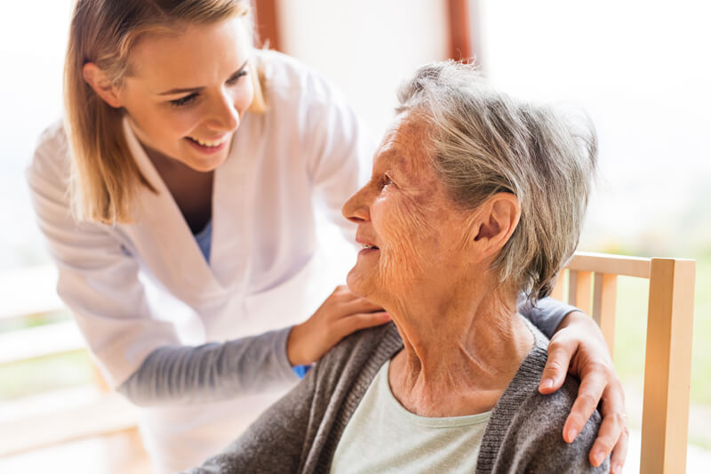 compassionate interaction between nurse and elderly woman